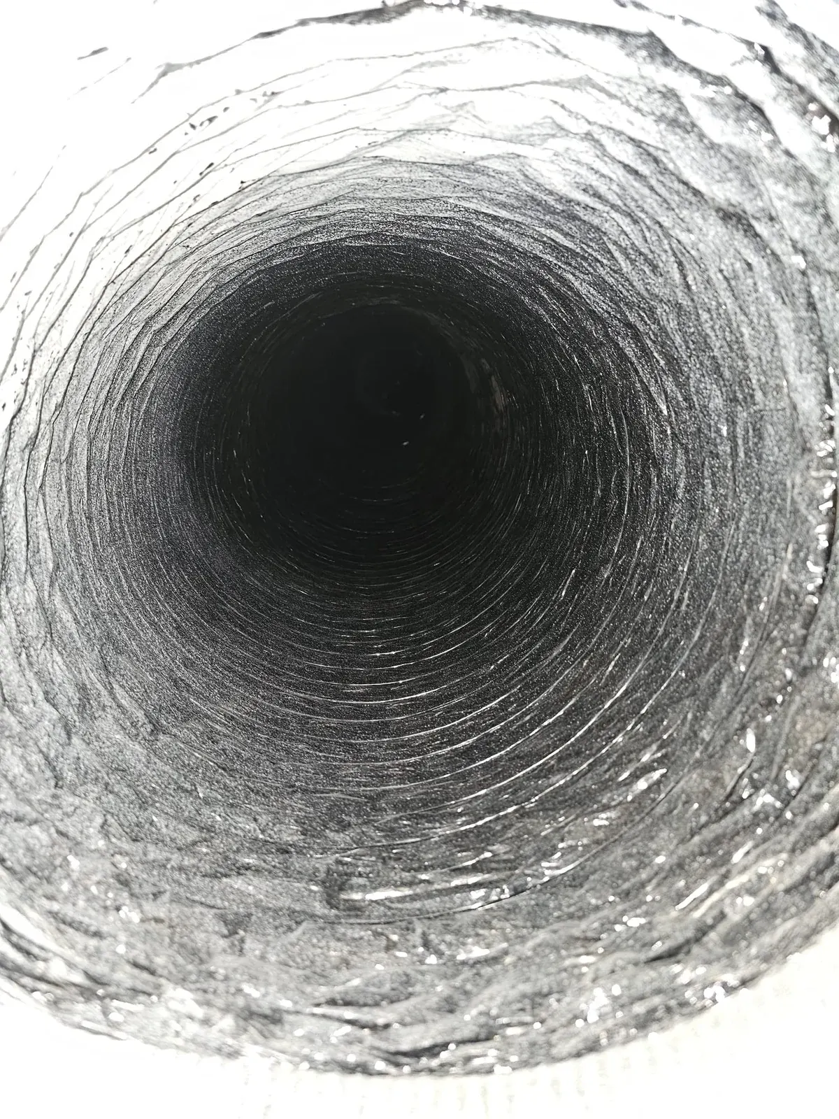 After: the same flexible duct with clean silver foil
