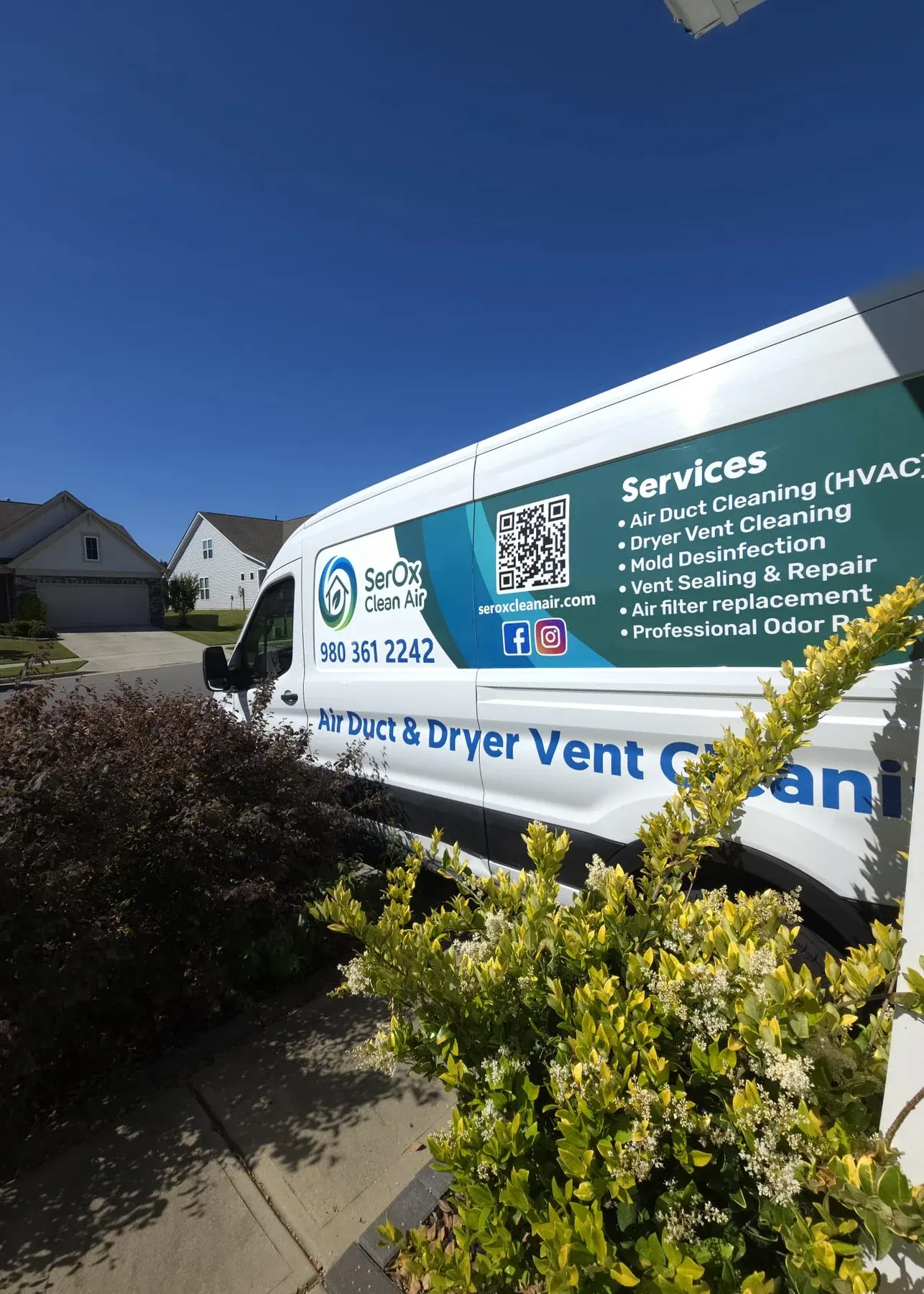 Branded SerOx equipment van parked curbside with the company logo and services list visible